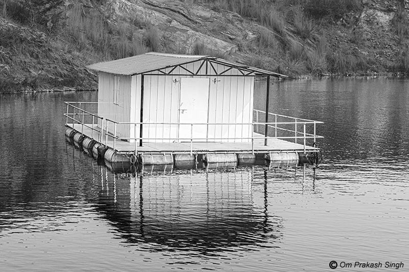 The floating cage house as a part of the infrastructure at the fish farm in the mining pit in Nandna village, Dumka district, Jharkhand